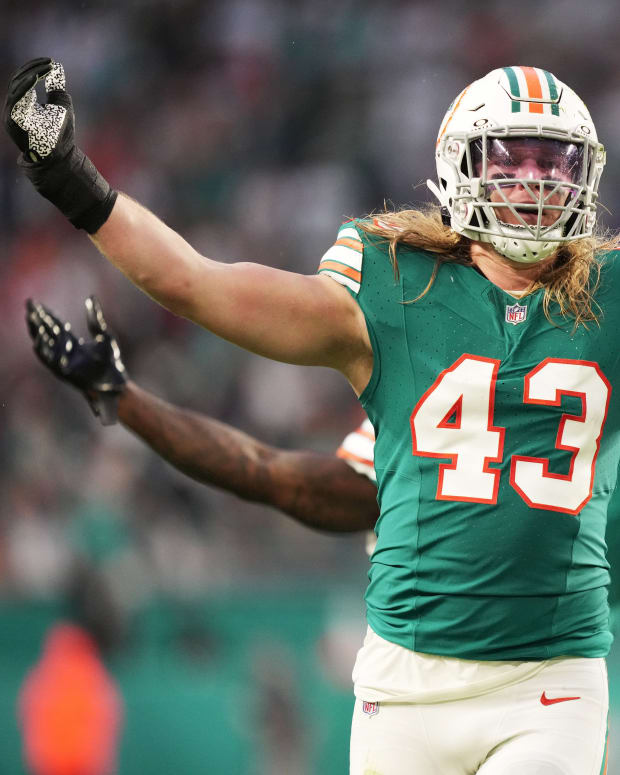 Miami Dolphins linebacker Andrew Van Ginkel (43) and linebacker David Long Jr., rear, celebrate a sack against the Dallas Cowboys during the first half of an NFL game at Hard Rock Stadium in Miami Gardens, Dec. 24, 2023.